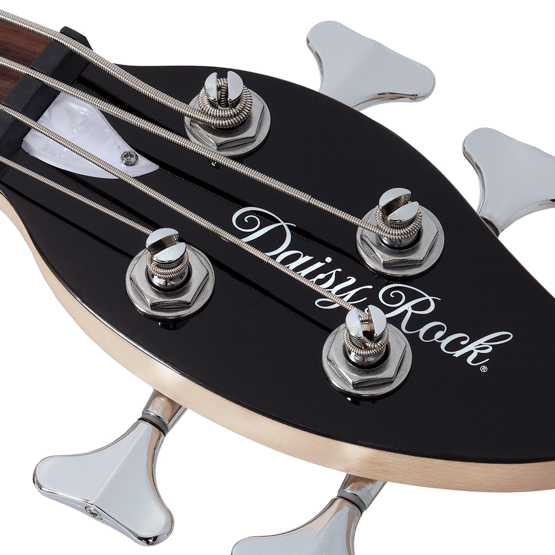 Close-up of a black electric bass guitar leaf-shaped headstock with 'Daisy Rock' branding on a white background
