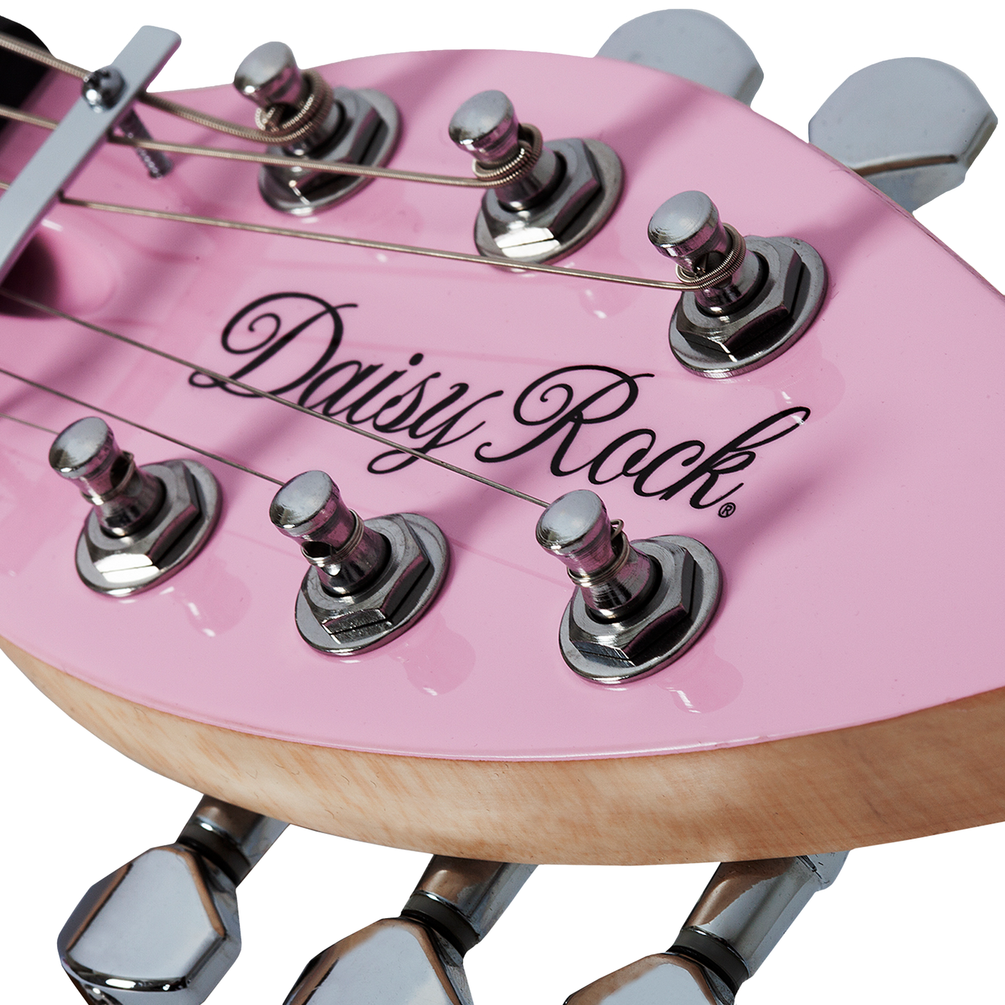 Close-up of a short scale pink electric guitar leaf-shaped headstock with 'Daisy Rock' branding on a white background