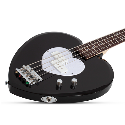Black electric bass guitar with a heart-shaped body and white pick guard on a white background
