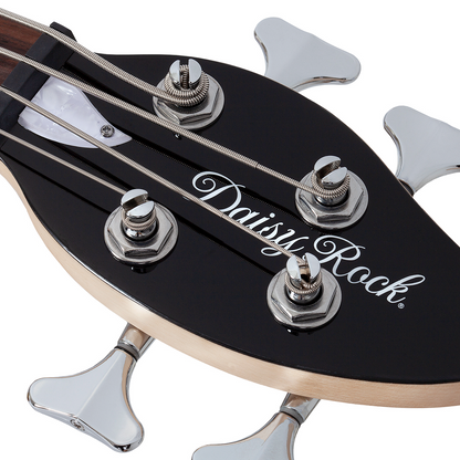 Close-up of a black electric bass guitar leaf-shaped headstock with 'Daisy Rock' branding on a white background