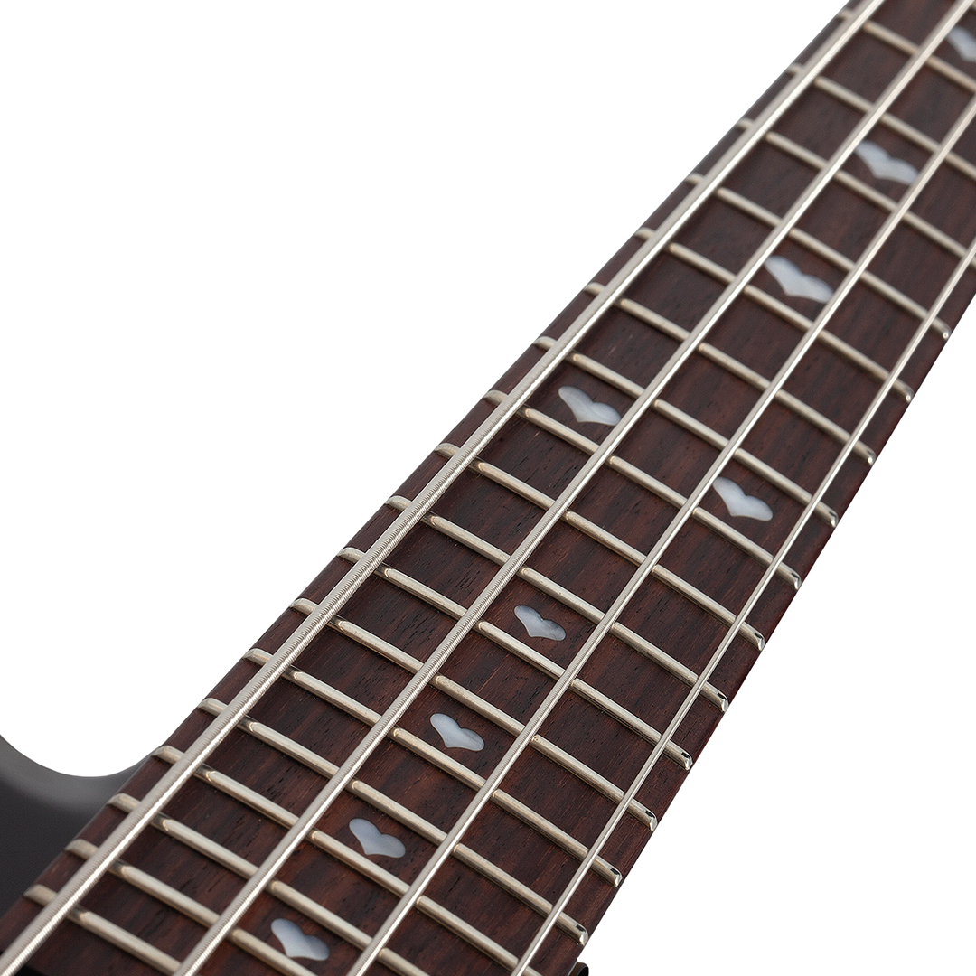 Close-up of a black electric bass guitar neck with frets, strings, heart-shaped inlays on a white background