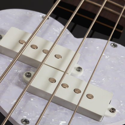 Close-up of a back electric bass guitar bridge and strings with a white pearlescent pick guard