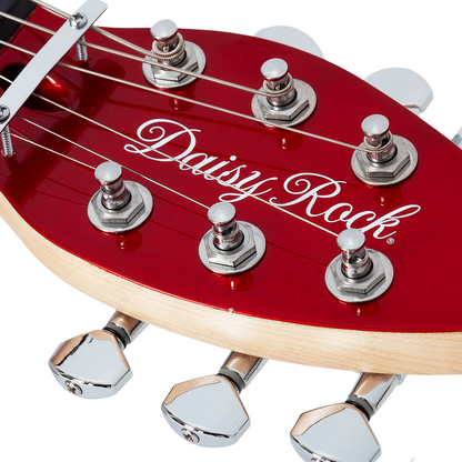 Close-up of a red electric guitar leaf-shaped headstock with 'Daisy Rock' branding on a white background