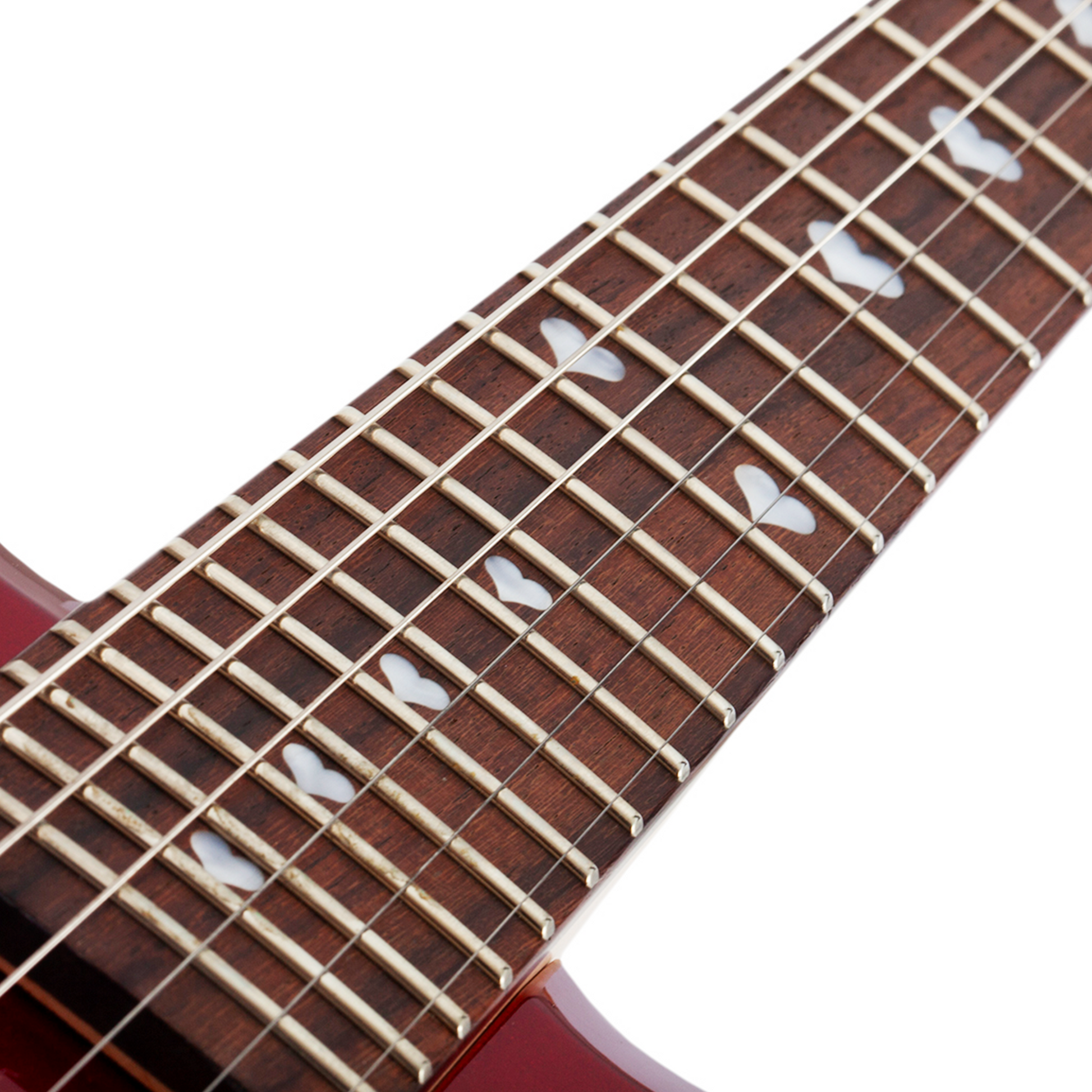 Close-up of a short scale red electric guitar neck with frets, strings, heart-shaped inlays on a white background