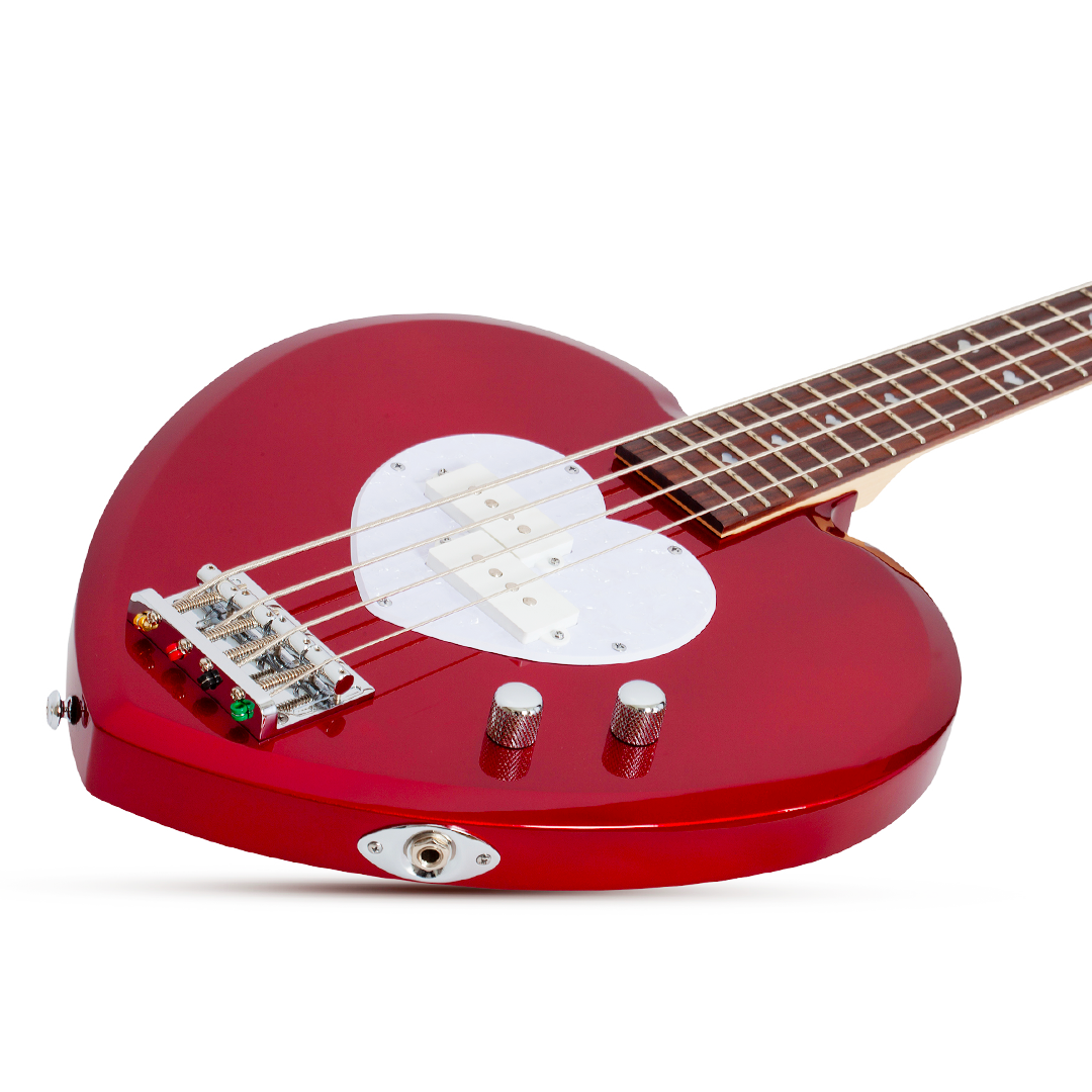 Red electric bass guitar with a heart-shaped body and white pick guard on a white background
